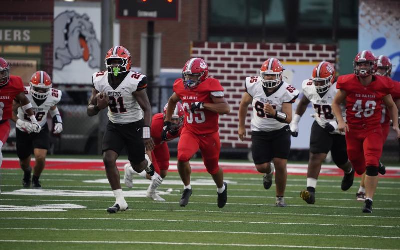 Junior running back Faustino Rangel breaking out a long run in the 28-14 loss to Madison County Aug. 22 in Danielsville. (Photo by Ric Williams)