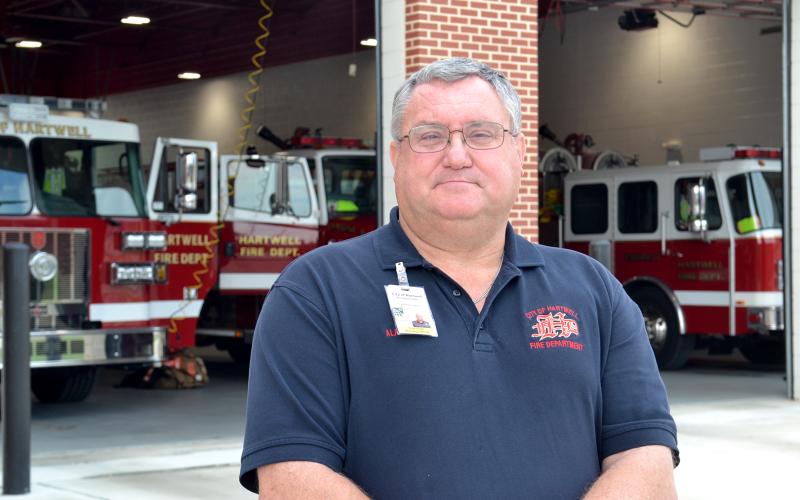 Fire Chief Alan Daniel poses in front of the Hartwell Fire Department, located at 456 E. Howell St., on Tuesday. Daniel is recognized this week as a hero of Hart County for his 41 years of service to the community. (Photo by Adriana Cascio)