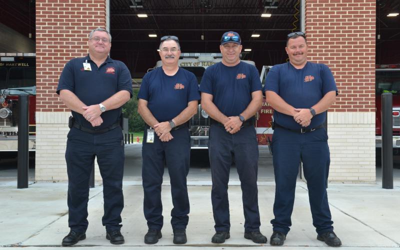 Fire Chief Alan Daniel stands with firefighters Mark Cordell, Jonathan Miller and Kevin Norris in front of the Hartwell Fire Department, located at 456 E. Howell St., on Tuesday. Daniel said that his team of 10 full-time and 30 volunteer firefighters are all dedicated to saving lives and protecting the city of Hartwell. (Photo by Adriana Cascio)