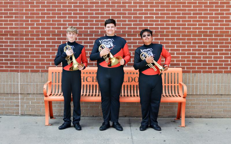 Mellophonists Caden Howell, Zeb Brister and Timothy Nguyen pose with their instruments. The mellophones were named section of the week for this week’s High Notes series, recognizing their hard work to blend with the band and make their voices heard despite being a smaller section. (Photo submitted by Hilaree Hudson)