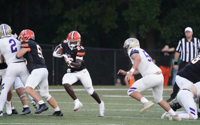 Sophomore running back Zeebo Harper dashing his way to a first down in the 19-14 loss to Lumpkin Aug. 29. (Photo by Ric Williams)