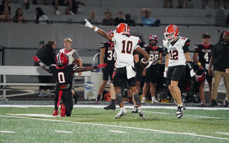 Pictured is junior wide receiver PJ Johnson (10) celebrating with junior wide receiver and quarterback Crew Franklin after making an acrobatic catch for the first down. (Photo by Ric Williams)