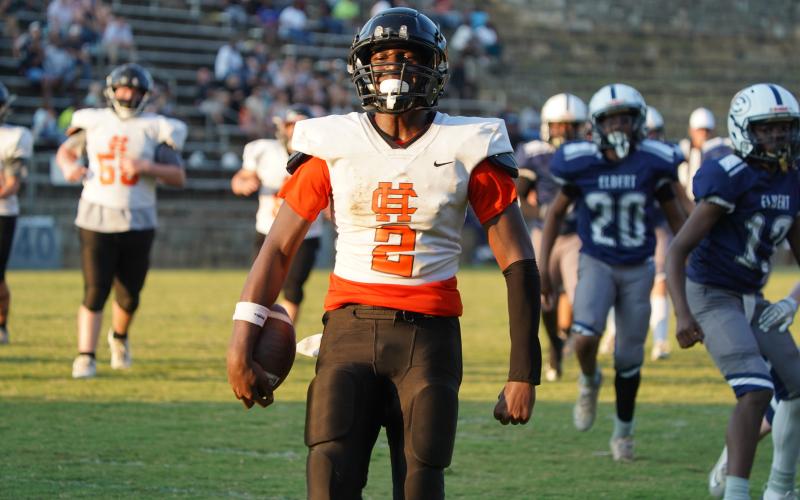 EJ Watkins celebrating after a touchdown run. (Photo by Ric Williams)
