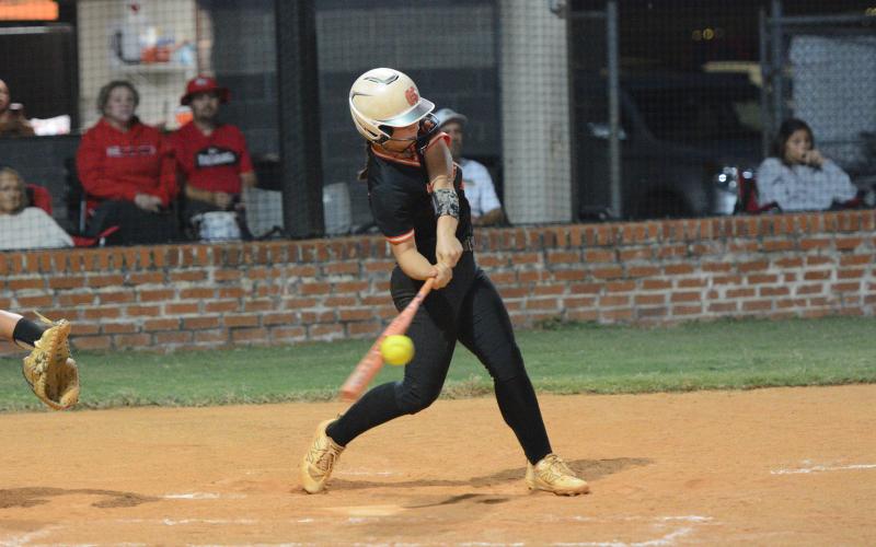 Sophomore infielder Emory McCollum hits a sacrifice fly in the bottom of the seventh inning to score a run as the Lady Dogs fell just shy of completing the comeback over the Lady Indians of Stephens County Sept. 9, 4-3. (Photo by Benjamin London)