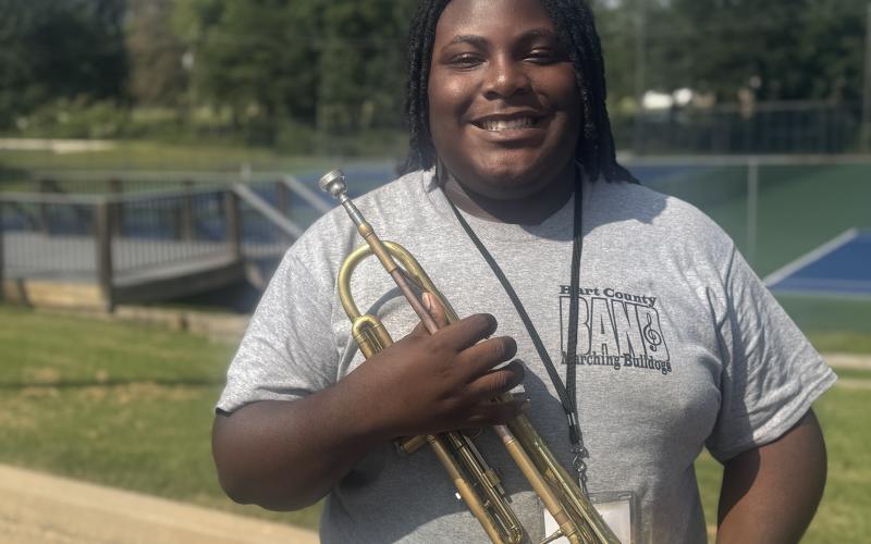 Band Lieutenant Ja’Siah Geter poses with his trumpet after being named officer of the week for this week’s High Notes series. Band leaders selected Geter because he is always willing to assist the band in any way necessary. (Photo by Adriana Cascio)