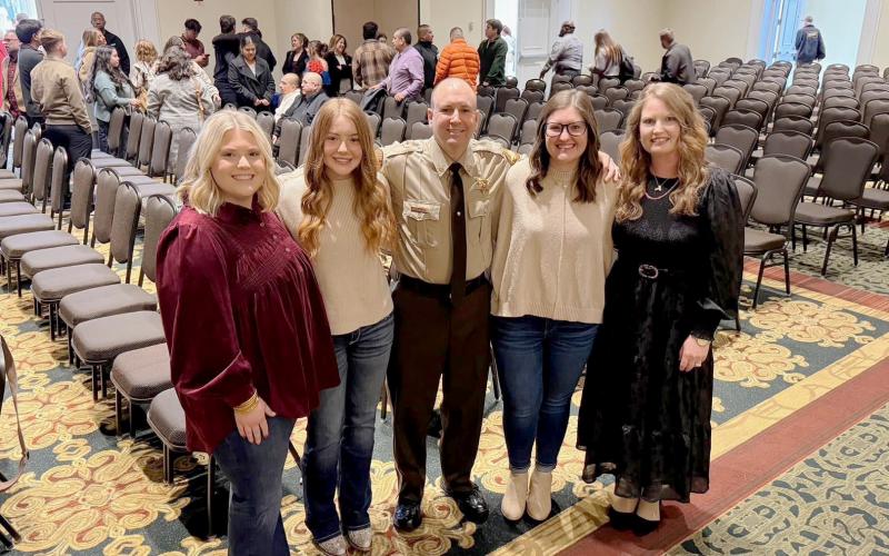 Sheriff’s Deputy Shane Turner stands with his family, his inspiration for becoming a law enforcement officer, during his graduation from the Georgia Public Safety Training Center in December. Pictured are (L-R) Courtney Turner Higgins, Morgan Turner, Shane Turner, Hannah Turner Jones and Jenny Turner. (Photo courtesy of Shane Turner)