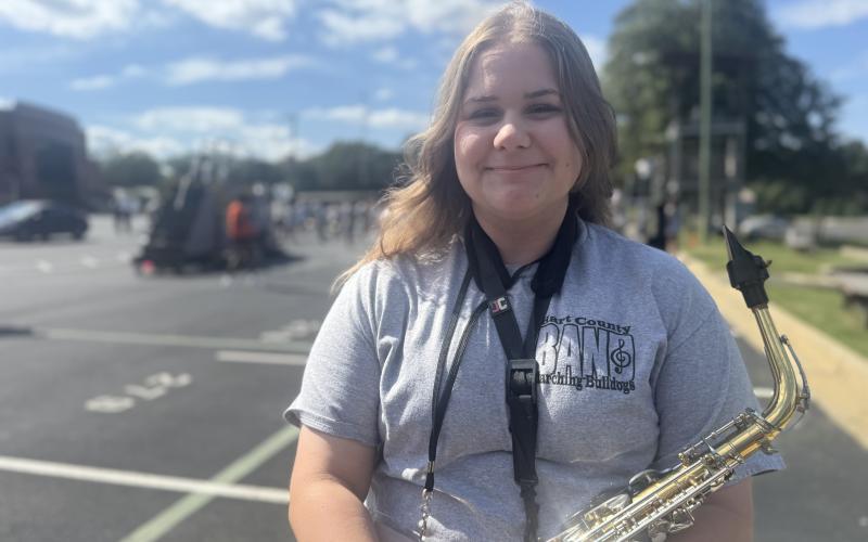 Senior Band Lieutenant Breanna Carruth smiles after being named officer of the week for this week’s High Notes series. Aside from marching the saxophone, Carruth ensures that the band is equipped with all necessary resources. (Photo by Adriana Cascio)