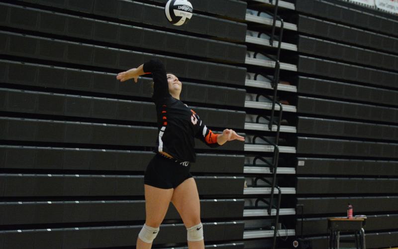 Junior setter Josee Fleming serves the ball into play during the 2-0 win over the Lady Eagles of East Jackson Sept. 11. (Photo by Benjamin London)