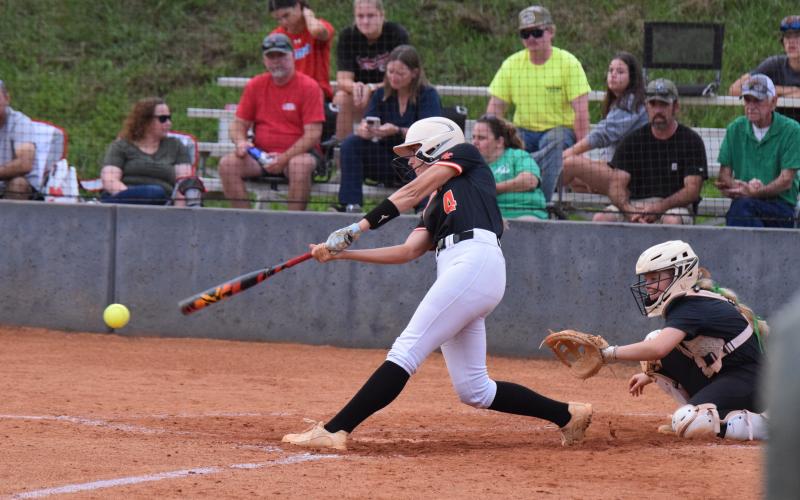 Senior infielder Madi Bennett collects a hit as she went 2-4 with a run and a run batted in against Franklin Aug. 28.  (Photo by Shane Scoggins)