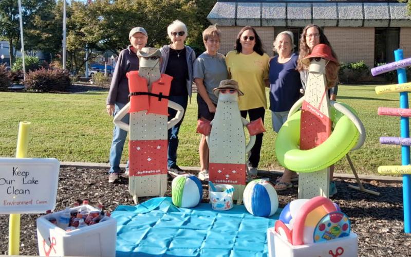 Members of the Hartwell Service League’s Environment Committee (L-R) Sandra English, Ann Murray, Margo Fleming, Karen Senkbeil, Lucy Rowland and scarecrow chairperson Tracy Brown set up their scarecrow on the Hart County courthouse grounds recently as part of this year’s “Scarecrows on the Square” contest. Voting for the contest is open through Oct. 29. The ballot can be found on page 2A of today’s edition. (Photo courtesy of the Hartwell Service League)