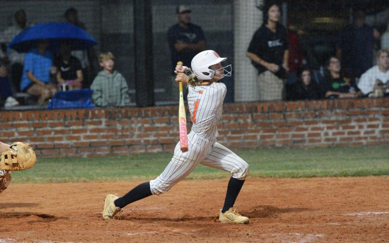 Freshman designated hitter Chloie Lack singles on a fly ball to left field to score the game winning run in the ninth inning to help the Lady Dogs capture a 6-5 win over the Lady Lions of Franklin County Sept. 29. (Photo by Benjamin London)