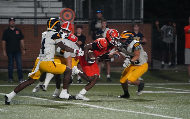 Senior safety Ramarcus Simpson returning the game winning interception. (Photo by Ric Williams)