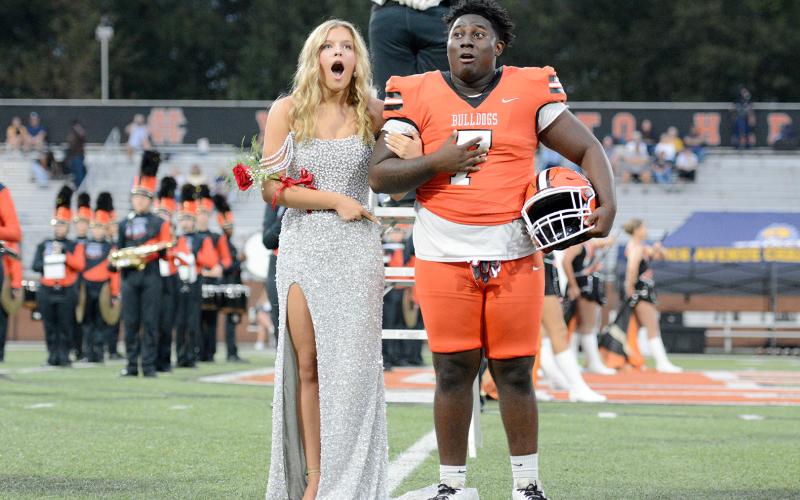 Erin Miller and senior football player Ormani Rucker react as Miller was announced as the 2025 Miss Bulldog prior to the game. (Photo by Benjamin London)