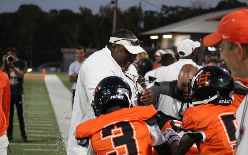 HCMS head football coach Earl Fouch soaks it in after a Gatorade bath in the 27-12 win over Madison County to capture the NEGIAA Championship Oct. 16. (Photo by Benjamin London)