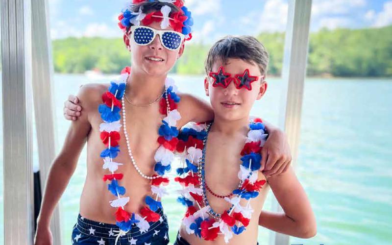 Kim Caudell of Toccoa captured this photo of her sons, Britt and Benjamin, celebrating Independence Day at Lake Hartwell. Caudell won $100 for her photo, which was featured on the cover of the 2025 summer edition of Lake Living magazine. (Photo from Summer 2025 Lake Living)