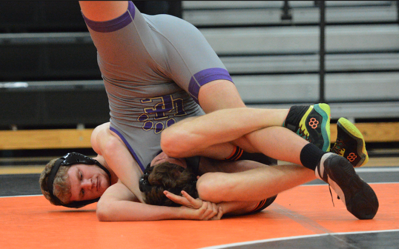 Senior Ethan Stovall pins his opponent in the 40-35 win over Union County Nov. 20 in the Dog Pound.