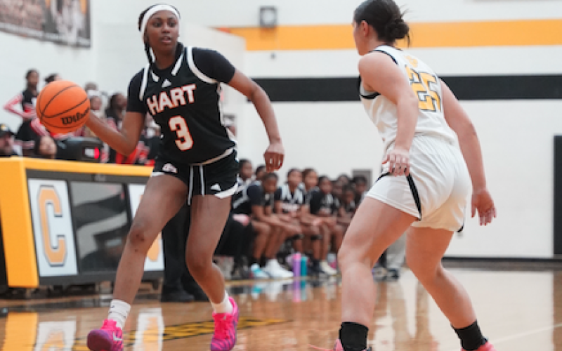 Junior guard Kiasia Montgomery looks to pass to an open teammate in the paint during the dominant 70-28 win over the Lady Tigers of Crescent Dec. 12. (Photo by Ric Williams)