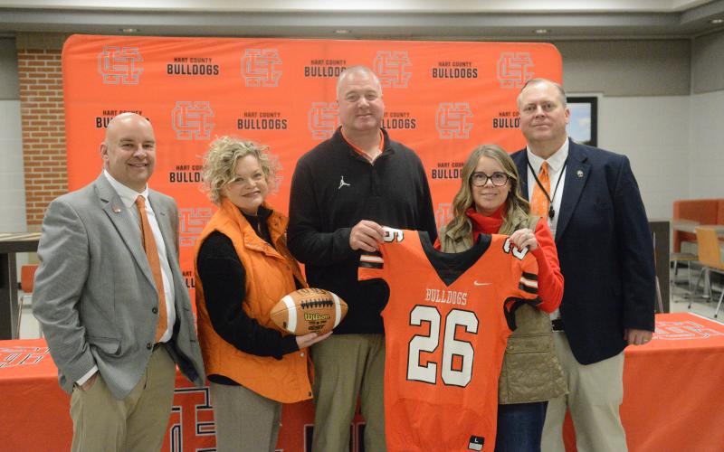 Pictured from left is assistant superintendent Brooks Mewborn, superintendent Jennifer Carter, new HCHS head football coach Biff Parson, chair of the board of education Kim Pierce and principal of HCHS Kevin Gaines at the introductory press conference Jan. 15. Photo by Benjamin London.