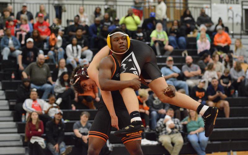 Junior Champ Blackwell goes to flip over his opponent as he ended up pinning his opponent to help the Mat Dogs capture a 73-6 win over Stephens County on senior night Jan. 6. Photo by Benjamin London.
