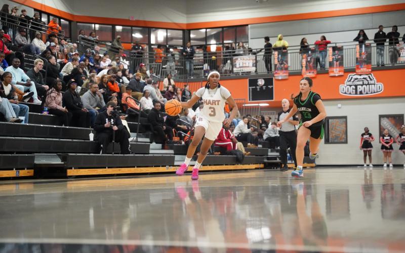 Senior forward Kiasia Montgomery (left) races up the floor on a fast break in the 46-32 win over the Lady Lions of Franklin County Jan. 20. Photo by Ric Williams.