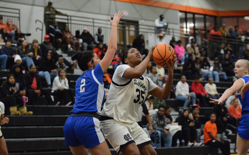 Sophomore forward Sarai Shealer drops 19 points to lead the team in scoring in the 59-47 loss to Oconee County in the McDonald’s Shootout Championship Game Dec. 30. Photo by Benjamin London.