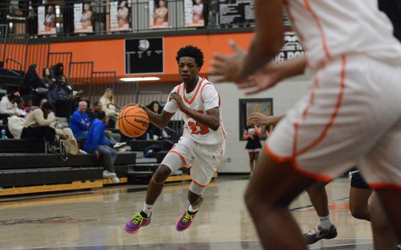 Sophomore guard Terrion Rucker drives to the rim, as he led the team with 17 points in the 57-55 loss to the Lions of Luella Dec. 30. Photo by Benjamin London.