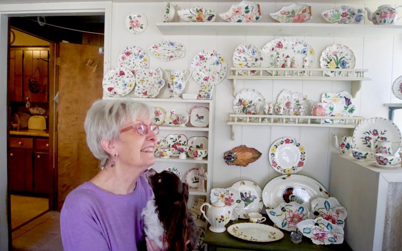 Brenda Spears, with her dog, Petey, remembers the life of her late husband, Buddy, through their mutual love of pottery and antiques. Photo by Madison Linton.