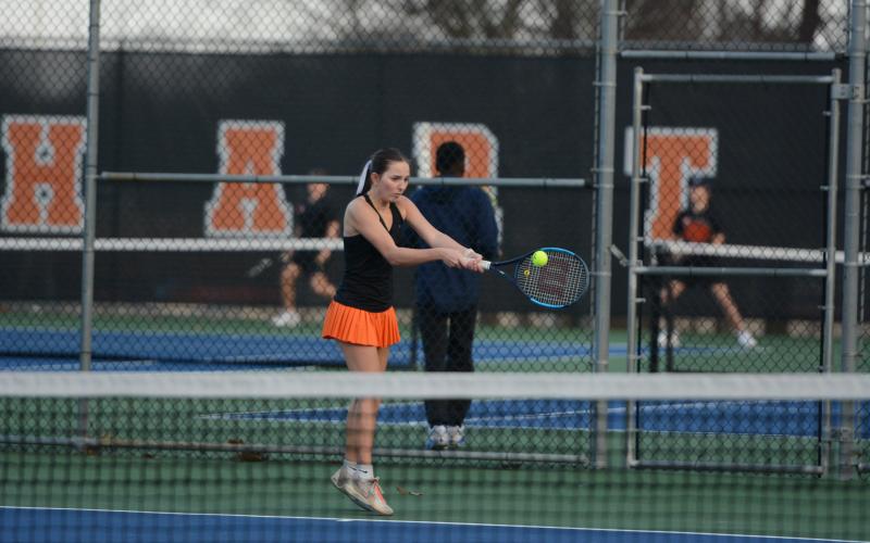 Gabriella Bernasky returns a serve in the 4-0 win over the Lady Devils of Elbert. Photo by Benjamin London.