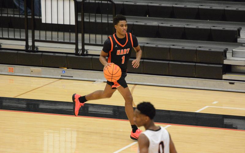 Junior guard Kurston Curry brings the ball up the floor in the 83-52 win over Stephens County in Toccoa Feb. 10. Photo by Benjamin London.