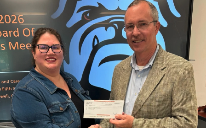 Georgia Power's Kevin McCraney (right) presents a donation to Hart County Chamber of Commerce President and CEO Amanda Brown (left) to fund the first year of a Georgia Foundational Leadership and Entrepreneurial X-Perience (FLEX) Program at the Hart County College and Career Academy. Photo submitted by the Hart County Chamber of Commerce.