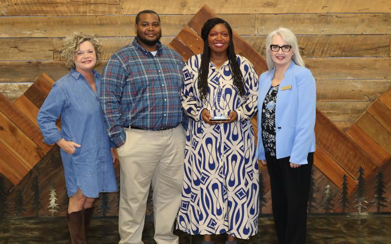 Pictured (L-R) are Superintendent Jennifer Carter, Mathius McNeill, Hartwell Elementary School Principal Ashley McNeill and Julie Franklin after Ashley received the district's 2025-2026 Philip Wright Award at Pioneer RESA. Photo submitted by Grayson Williams.