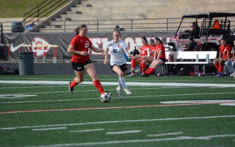 Forward Isla Bell (right) battles against a Lady Indians defender in the 2-1 road loss to Stephens County March 20. Photo by Benjamin London.