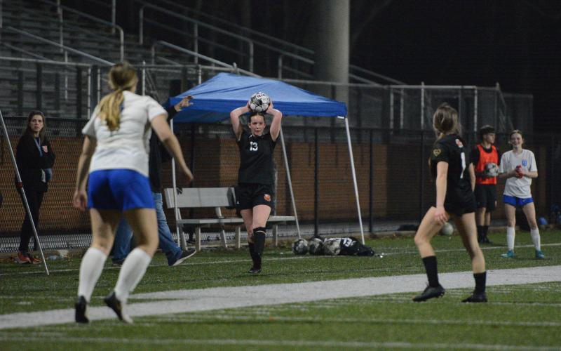 Midfielder Madison Heaton throws the ball into play during a match earlier in the season, as she scored two goals in the 6-0 win over Greene County March 16. Photo by Benjamin London.