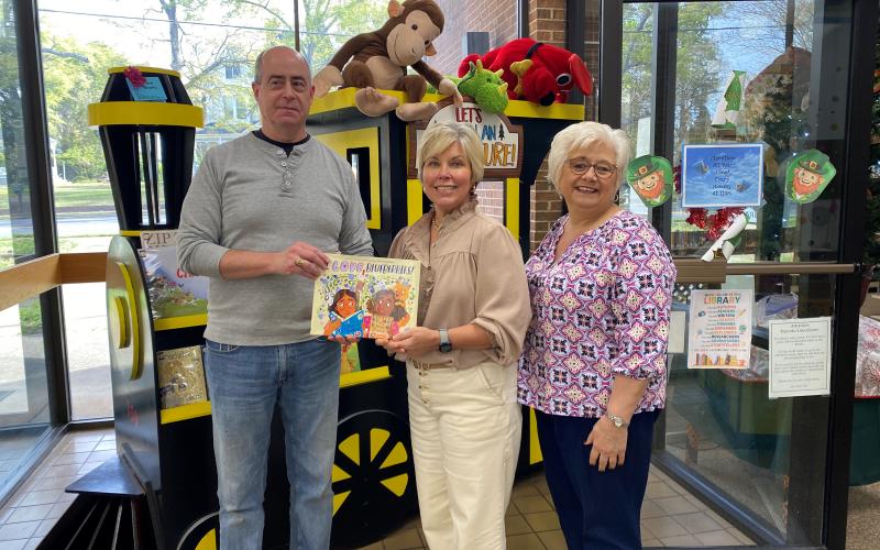 Hart County Farm Bureau Office Manager Tina Simmons (right) and Angie Brown from Hart EMC (center) recently presented a copy of the children’s ag book “I Love Blueberries” to Richard Sanders (left) for the Hart County Public Library. The donation was made on behalf of the Georgia Foundation for Agriculture and Georgia EMC. (Photo submitted by Tina Simmons)
