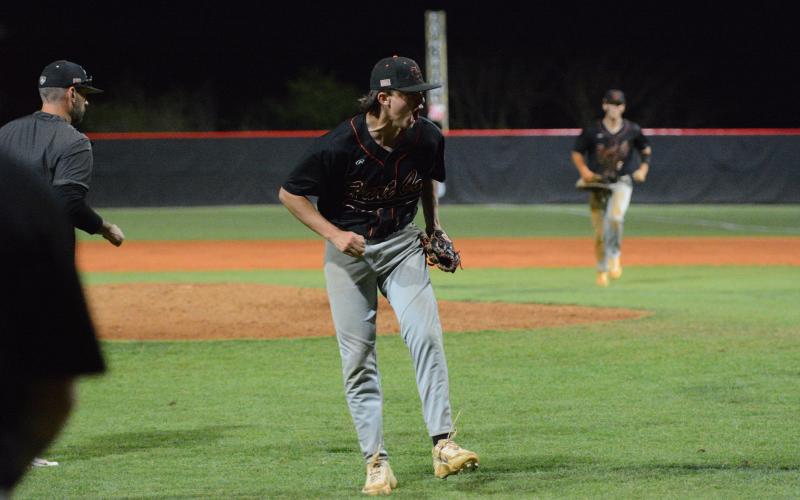 Sophomore pitcher Aiden Kennedy celebrates after striking out the final batter to hang on to win, 7-6, against the Indians of Stephens County in eight innings March 30. Photo by Benjamin London.