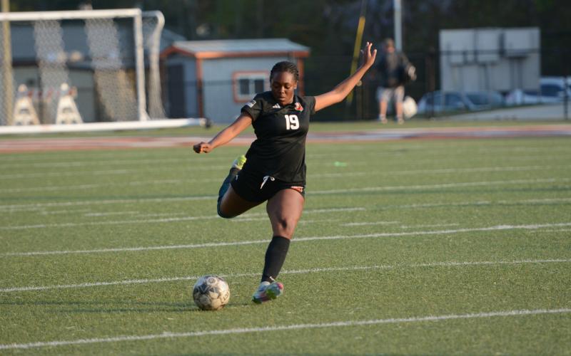 Aidyn Craft scores off of a free kick in the 7-0 shutout win over the Lady Bulldogs of Thomson April 3.  Photo by Benjamin London.