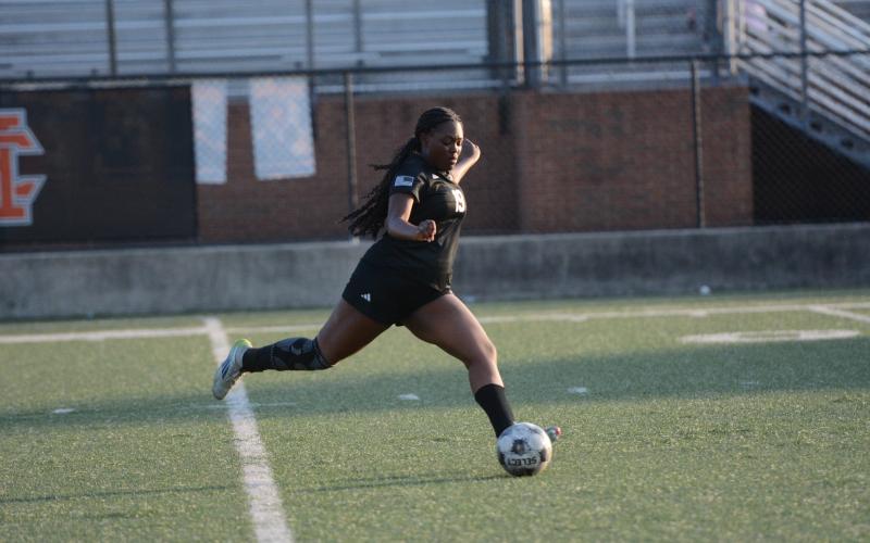 Aidyn Craft takes a free kick, as she later scored on a penalty kick in the 4-2 loss to Lady Cavaliers of Callaway in the first round of the state playoffs April 23.  Photo by Benjamin London.