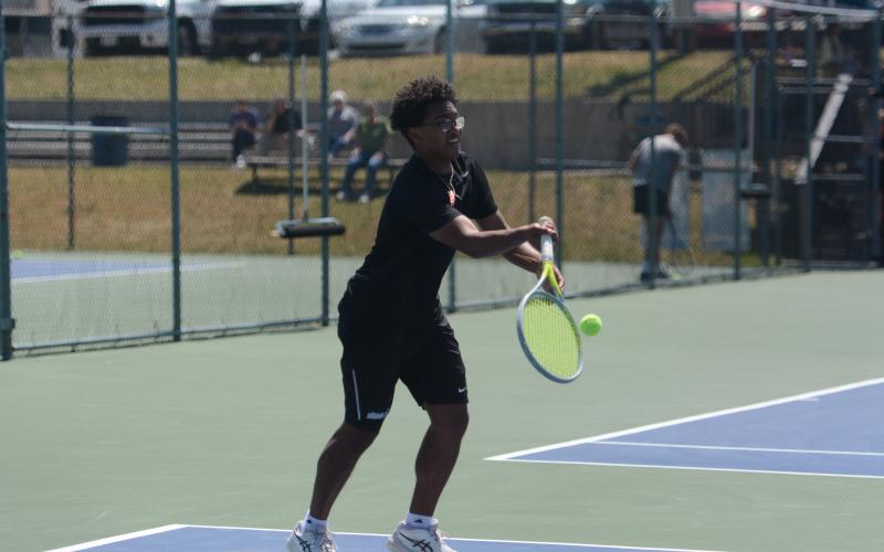 Derrick Campbell returns a serve, as him and Carson Hart dominated No. 2 doubles, 6-0 and 6-0, to help capture a 5-0 win over Hardaway April 22. Photo by Benjamin London.