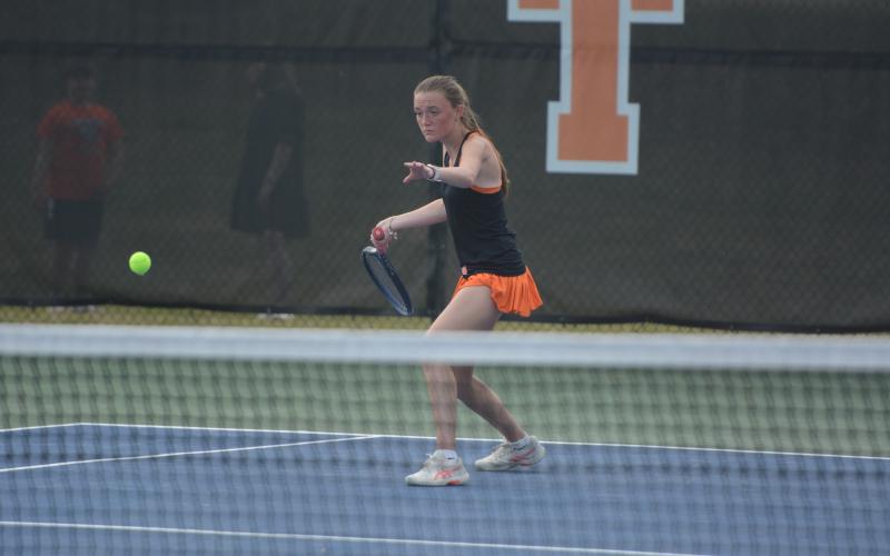 Senior Lucee Patrick rears back to return the serve, as the Lady Dogs fell just short on senior night to the Lady Indians of Stephens County, 3-2, March 26.  Photo by Benjamin London.