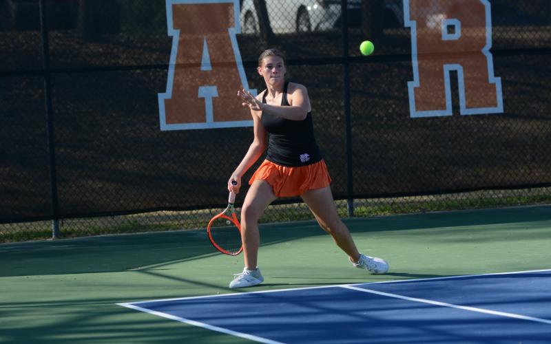 Lyla Phillips prepares to returns a serve from earlier in the season, as she won in the third set at No. 1 singles against the Lady Panthers of Savannah Arts April 23, to help send Hart to the Sweet Sixteen. Photo by Benjamin London.