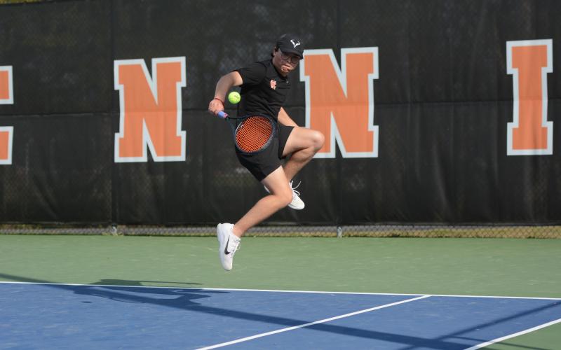 Senior Riley Gaines returns a serve in the 4-1 win over the Indians of Stephens County on senior night March 26. Photo by Benjamin London.