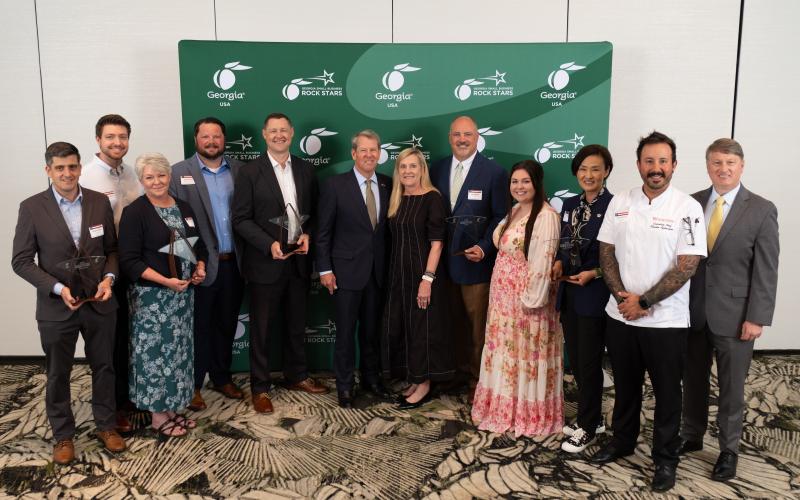 Group photo of the 2026 Small Business ROCK STARS, including Fabritex, Inc. President Lee Adams (eighth from left) and Marketing and Sales Director Jenny Scott (ninth from left) with Gov. Brian P. Kemp (sixth from left), First Lady Marty Kemp (seventh from left) and Georgia Department of Economic Development Commissioner Pat Wilson (far right). Photo by Ben Gray Photography, courtesy of the Georgia Department of Economic Development.