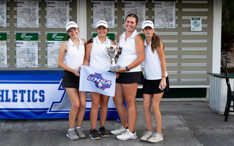 The Hart County High School girls golf team poses with the State Championship trophy after capturing the school's first state title in girls golf May 19. Photo by the Georgia High School Association.