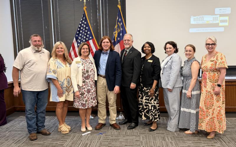 Senior Lockaby "Lock" Powell was honored by the Georgia Department of Education (DOE) with the prestigious "Award of Excellence" in April. He is pictured above and below with his family, members of the DOE and State School Superintendent Richard Woods. Photo by Grayson Williams.