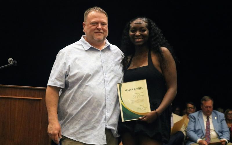 Left, Zy'tajia Moore (right) was awarded the Kelley Gaines TSA Memorial Scholarship by Greg Gaines during the senior awards night at Hart County High School April 29. Photo courtesy of Hart County Charter System.