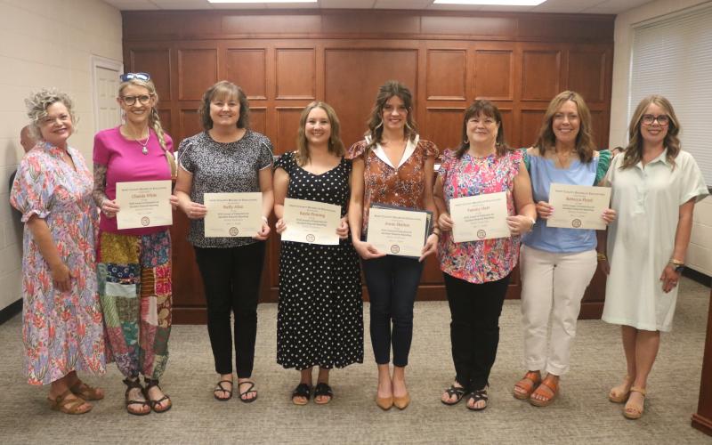 Pictured is superintendent Jennifer Carter (far left) and Hart County Board of Education chair Kim Pierce (far right) Chanda White, Hart County High School bookkeeper; Buffy Allen, accounts payable coordinator; Kayla Fleming, payroll and benefits coordinator; Annie Skelton, director of finance; Tammy Hart, school nutrition coordinator; and Rebecca Floyd, Hart County Middle School bookkeeper. Not pictured is Brittany Geraty, support services administrative assistant. Photo by Grayson Williams.