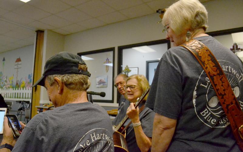 Above (L-R) Richard Frady, Daniel Meth, Jo Ann Moore and Terri Cleveland prepare for a performance at the Hart County Senior Center. Photo by Madison Linton.
