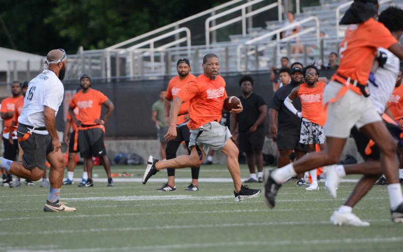 75 former players returned back to Herndon Stadium to compete in the second annual Harper Island Training Alumni Flag Football Game June 19. Photo by Benjamin London.