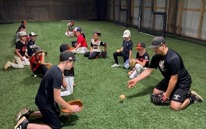 High school and middle school players help lead a fielding drill at the annual Youth Baseball Camp June 22-24. Photo submitted by Hart County Baseball.