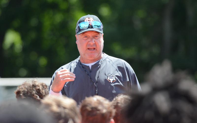 Hart County High School’s 18th head football coach Biff Parson speaks with the team after a summer practice inside Herndon Stadium June 15. Photo by Benjamin London.